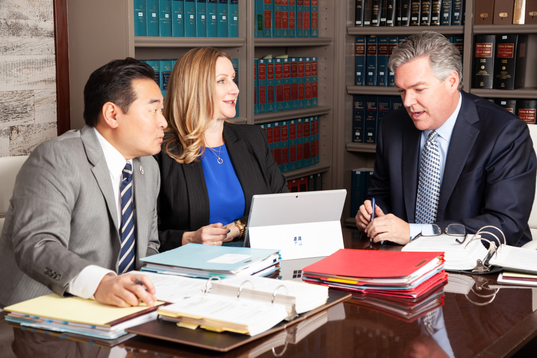 Lauriann Wright, David Kim, and J. Andrew Douglas at Conference Table Photo